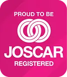 Pink square badge with white text reading PROUD TO BE JOSCAR REGISTERED and two interlocking white rings.